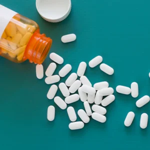 Spilled bottle of white pills